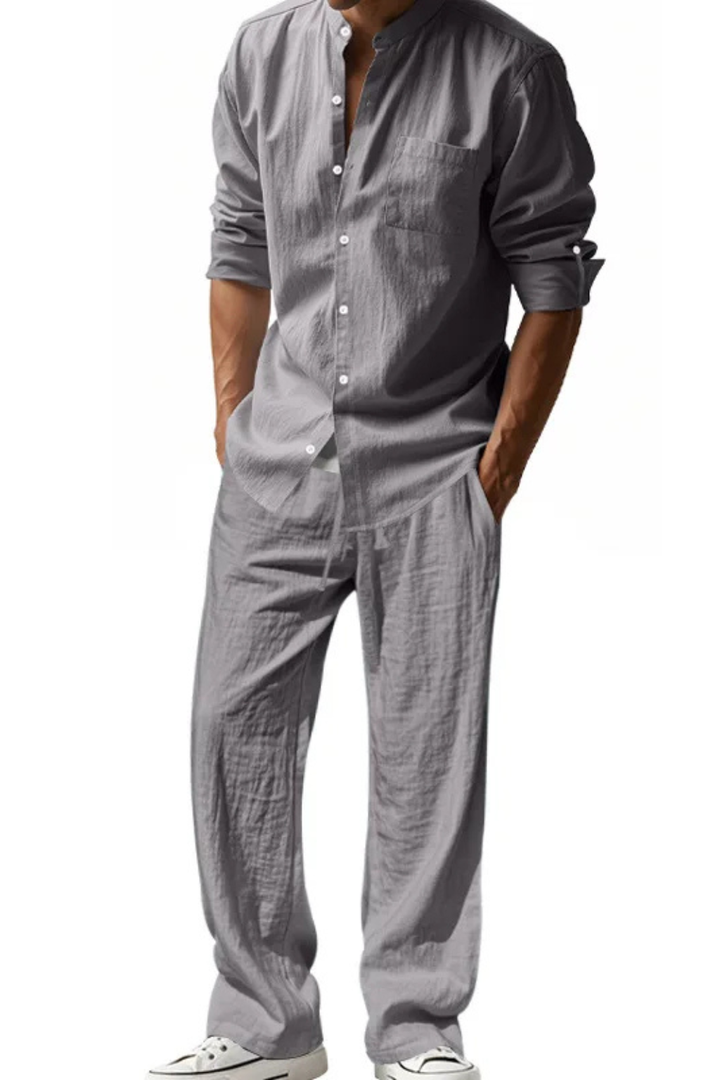 Model wearing men's grandad collar long sleeve shirt & trousers outfit, perfect for spring casual wear.