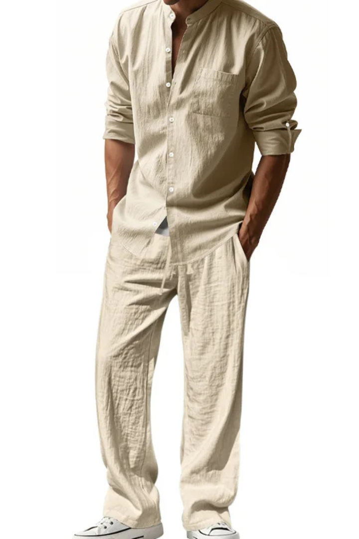 Men's grandad collar long sleeve shirt paired with comfortable trousers, a complete spring/summer outfit.