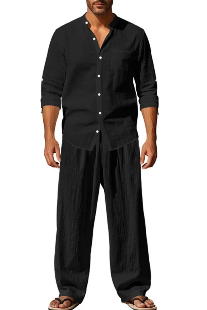 Coordinated men's long sleeve grandad collar shirt and matching trousers for a smart casual outfit.