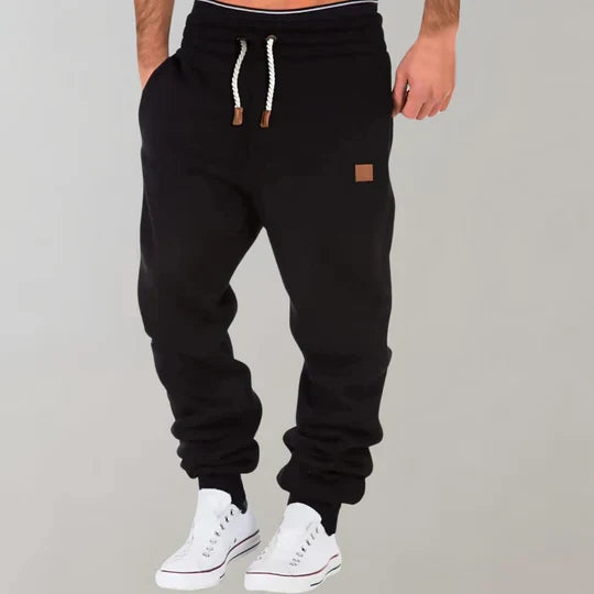 Comfortable men's athletic jogging pants in a relaxed fit, featuring an elastic waist and adjustable drawstring.