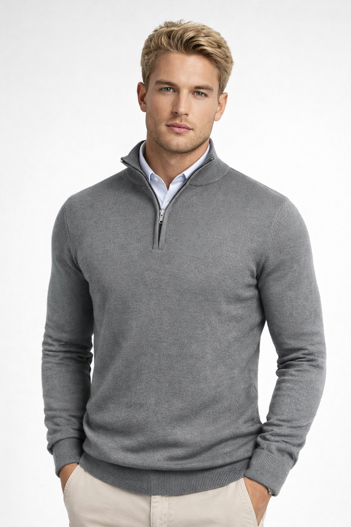 Detail of the zipper and high neck on a men's winter sweater, emphasizing its functional design.