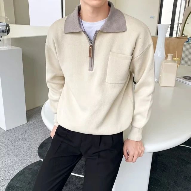 Stylish men's pullover sweater with half-zip and polo collar, ideal for elevated winter wear.