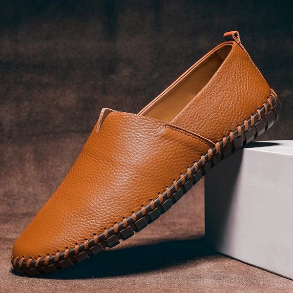 Close-up of men's hand-stitched comfort loafers, showing detailed craftsmanship & versatile design. Ideal casual footwear.