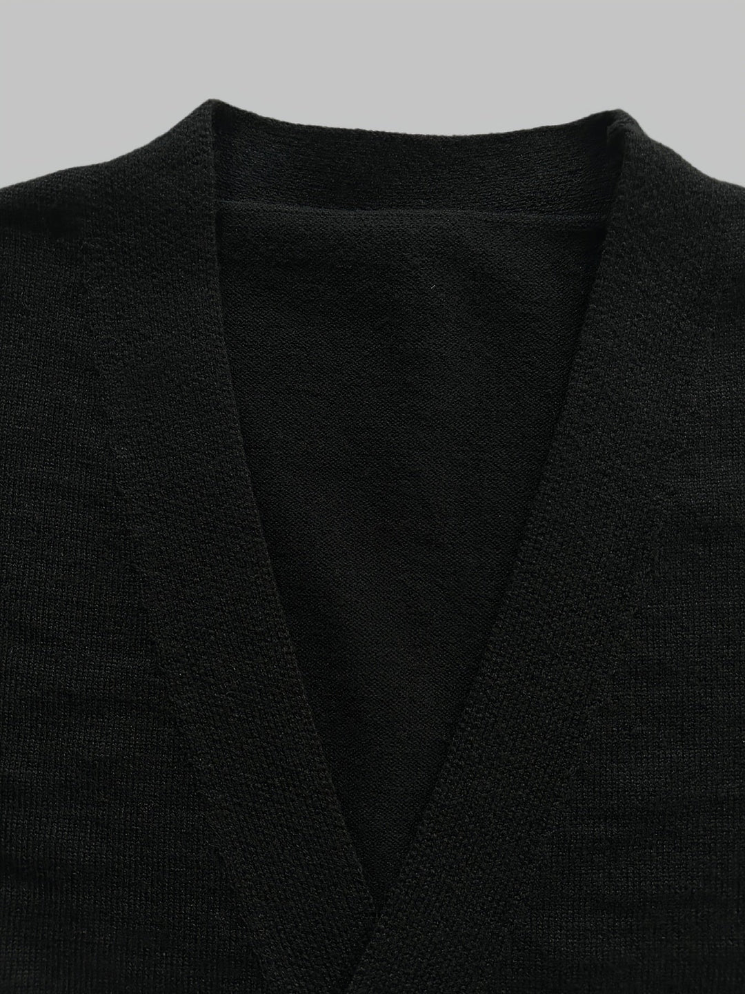 Model wearing a men's comfortable button cardigan, highlighting its regular fit & sophisticated style.