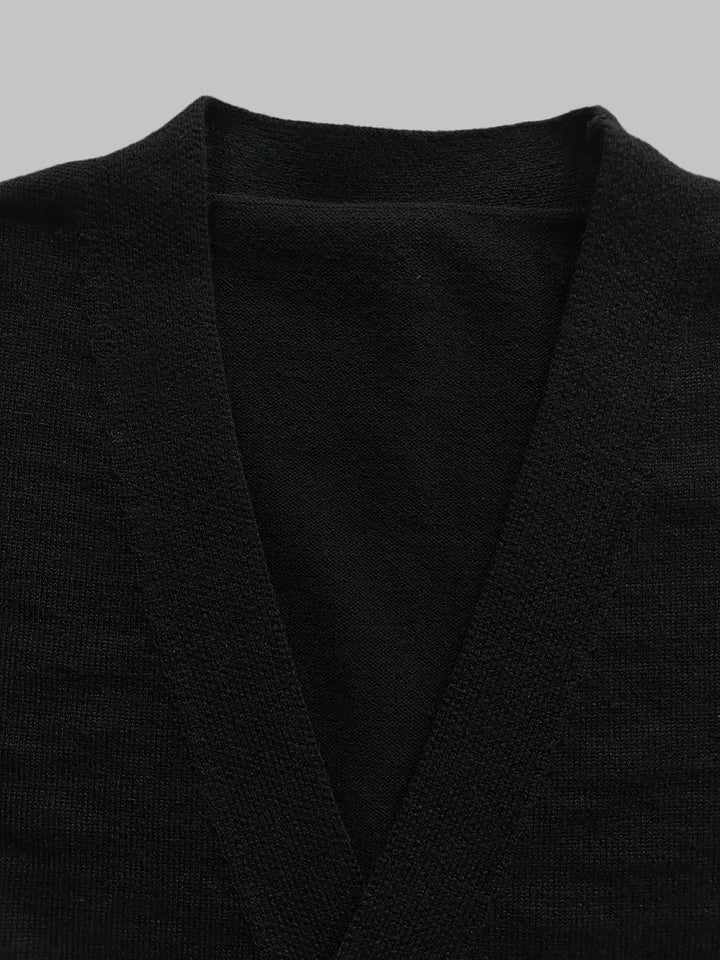 Model wearing a men's comfortable button cardigan, highlighting its regular fit & sophisticated style.