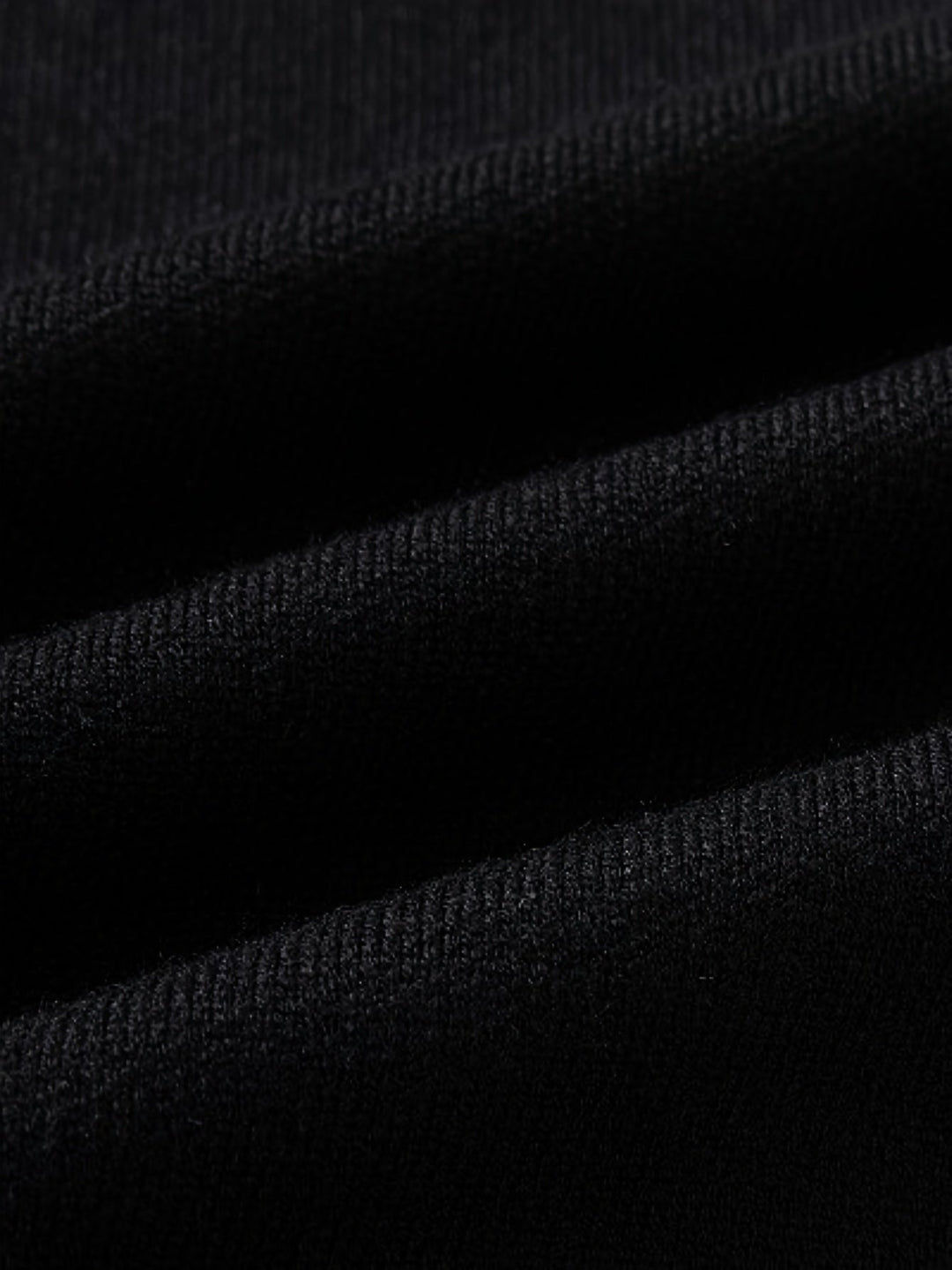 Side view of a men's handcrafted button-front cardigan, emphasizing its comfortable, regular fit.