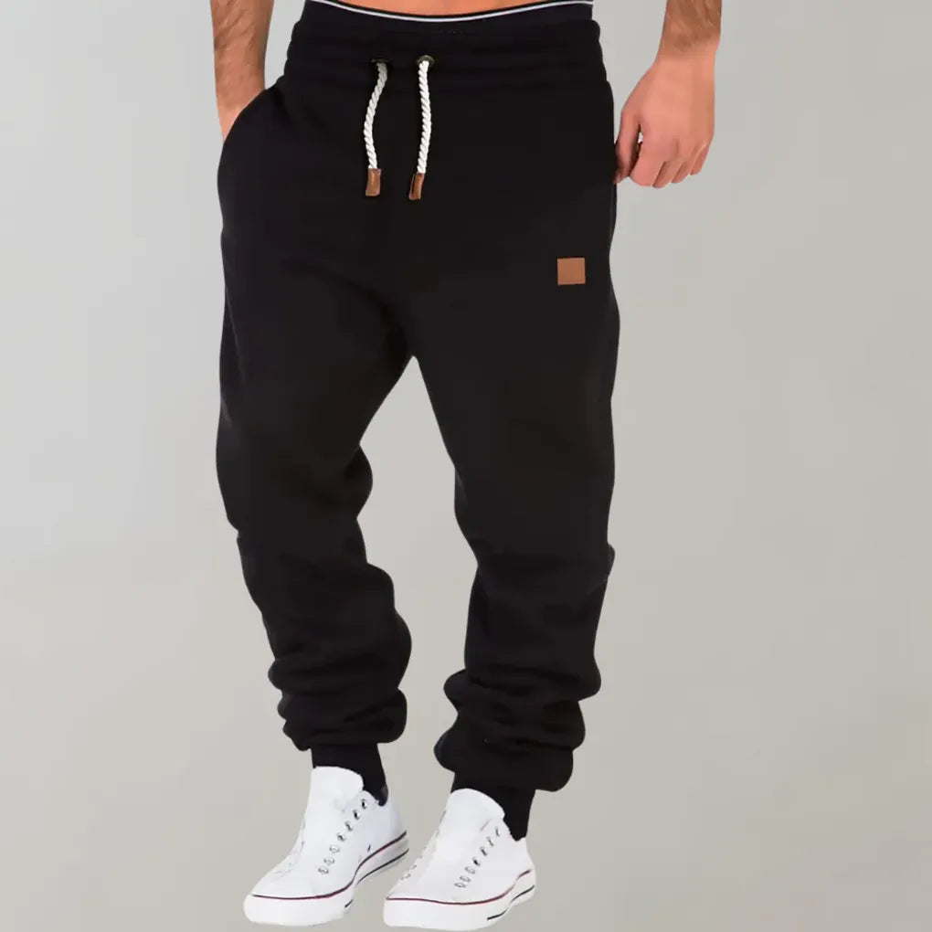 Men's relaxed fit jogger pants in cotton blend, perfect for casual wear, with comfortable drawstring waist.