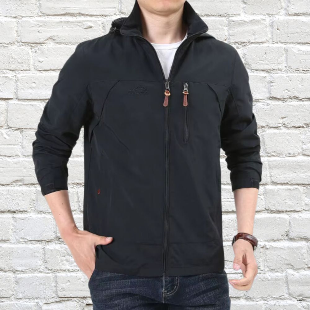 Man in a versatile hooded casual jacket, perfect for everyday outdoor adventures & comfort.