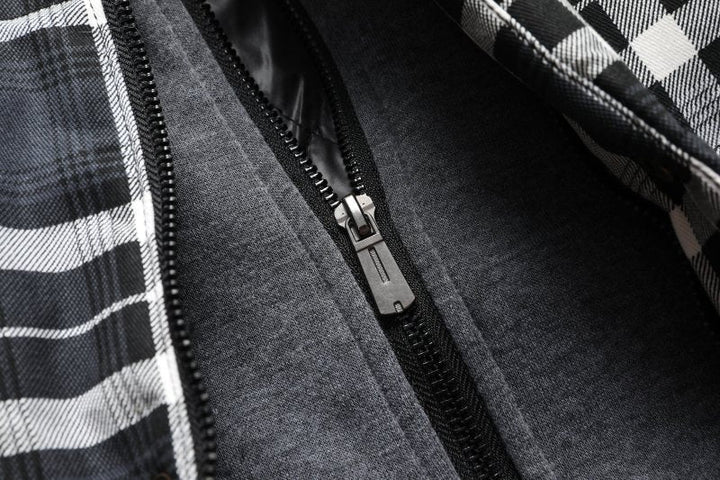 Man walking in stylish men's hooded plaid puffer vest, perfect casual fall outerwear.