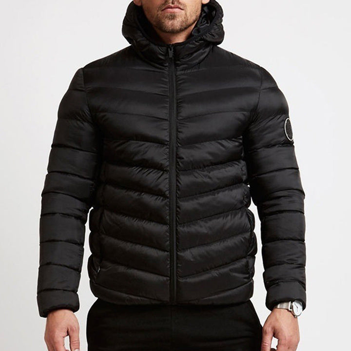 Men's hooded puffer jacket for ultimate warmth. Stylish quilted winter coat in black.