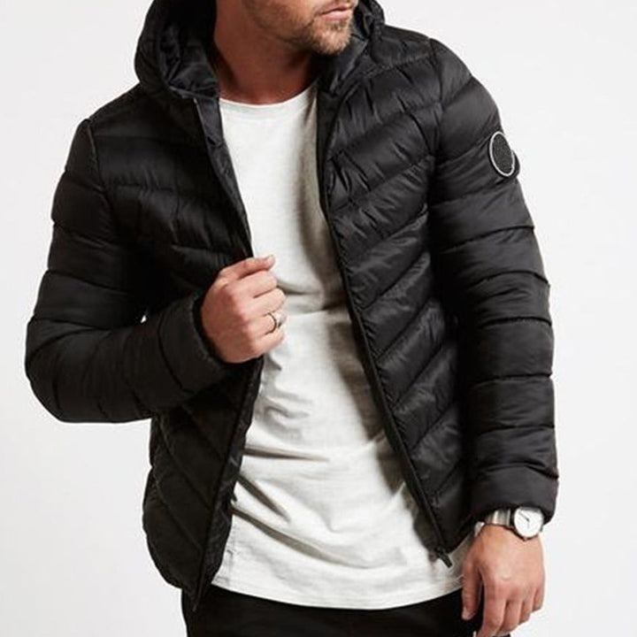 Black men's hooded puffer jacket, perfect for ultimate warmth & urban style. Quilted winter coat.