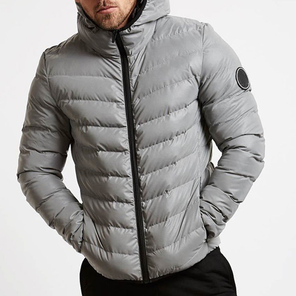 Stylish men's hooded puffer jacket. Grey quilted winter coat, ideal for casual urban outerwear.