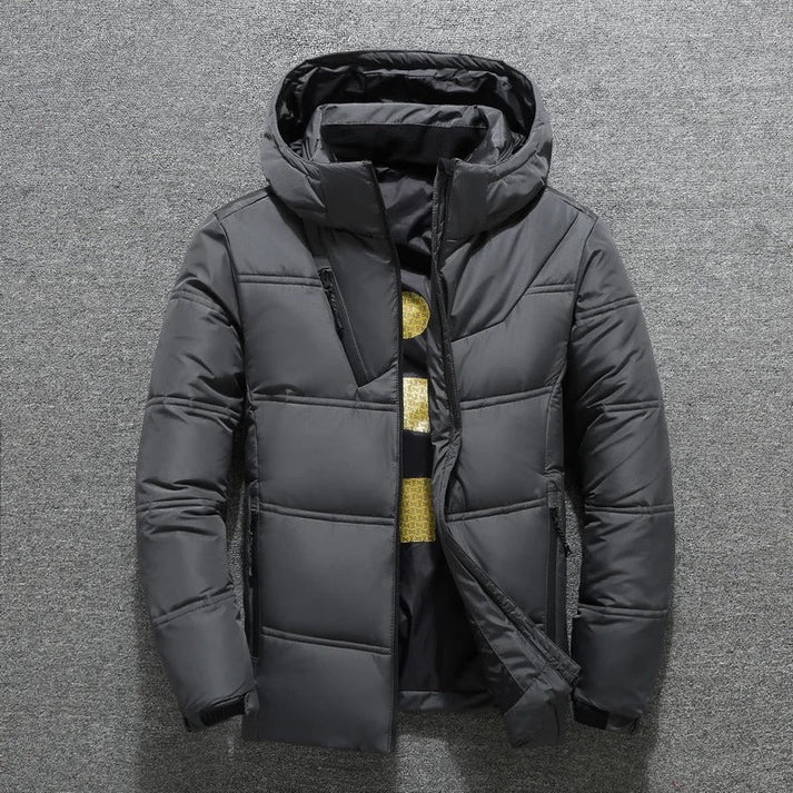 Stylish men's insulated quilted puffer jacket with hood, ideal for casual winter wear.