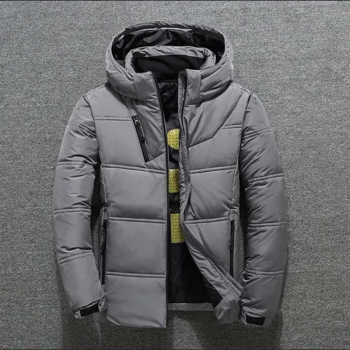Versatile men's hooded puffer jacket, quilted for maximum winter warmth in cold weather.