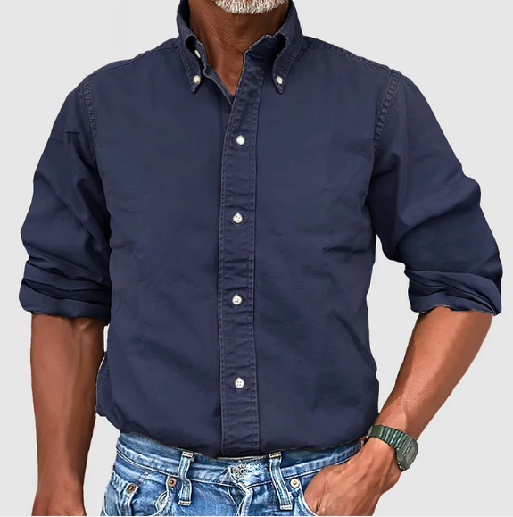 Close-up of the wrinkle-resistant fabric on a men's long-sleeve casual shirt, black color.