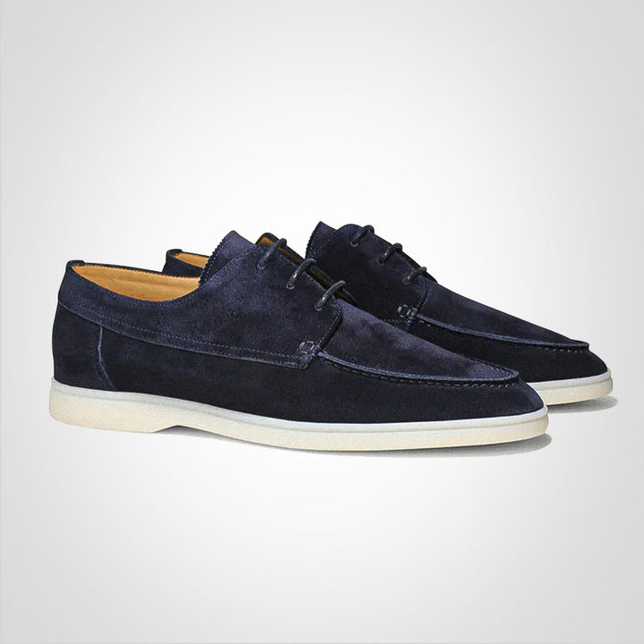 Stylish men's dark blue lace-up boat shoes, perfect casual footwear for summer fashion.