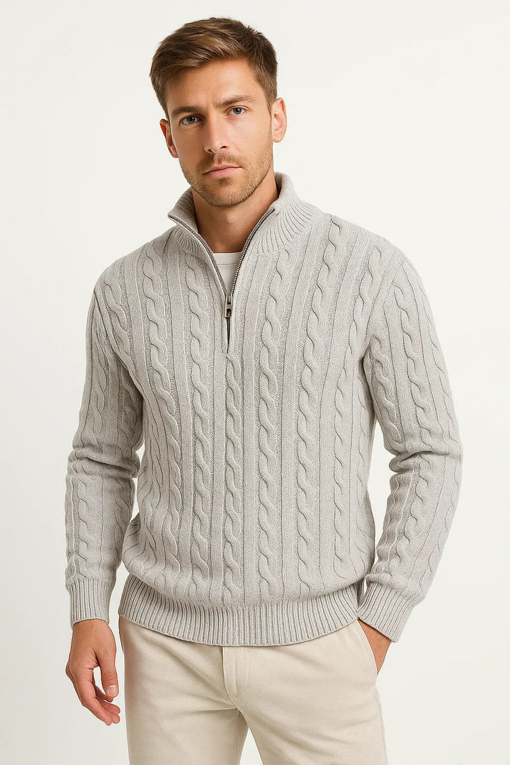 Close-up of a men's cream cable knit sweater with a sophisticated zip-neck design, ideal for spring