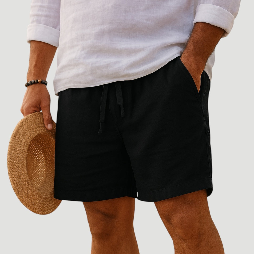 Stylish man wearing lightweight comfort fit shorts, perfect for summer casual outings and beachwear.