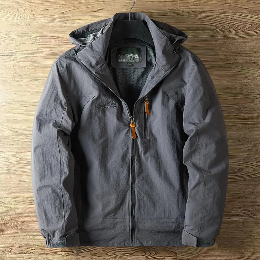 Stylish men's lightweight hooded rain jacket, waterproof & versatile for outdoor adventures or everyday casual wear.