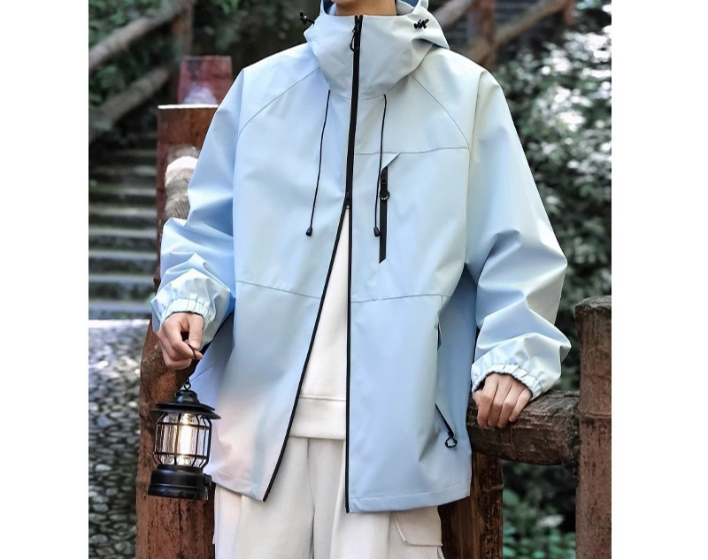 Front view of a men's outdoor hiking jacket with hood, ideal for lightweight protection.