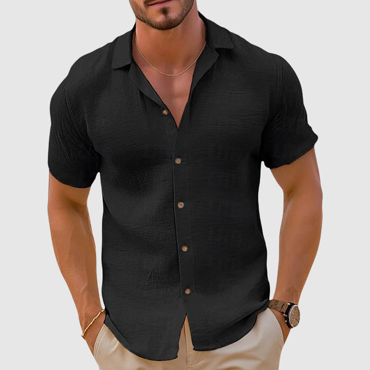 Relaxed fit men's linen short sleeve button up shirt, breathable and ideal for spring and summer.