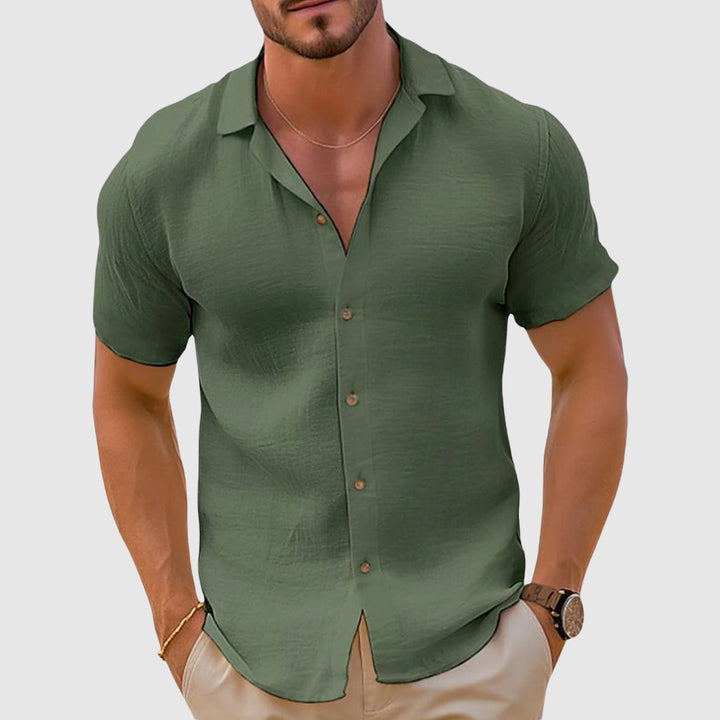 Breathable men's short sleeve linen button up shirt, offering a relaxed fit for casual occasions.