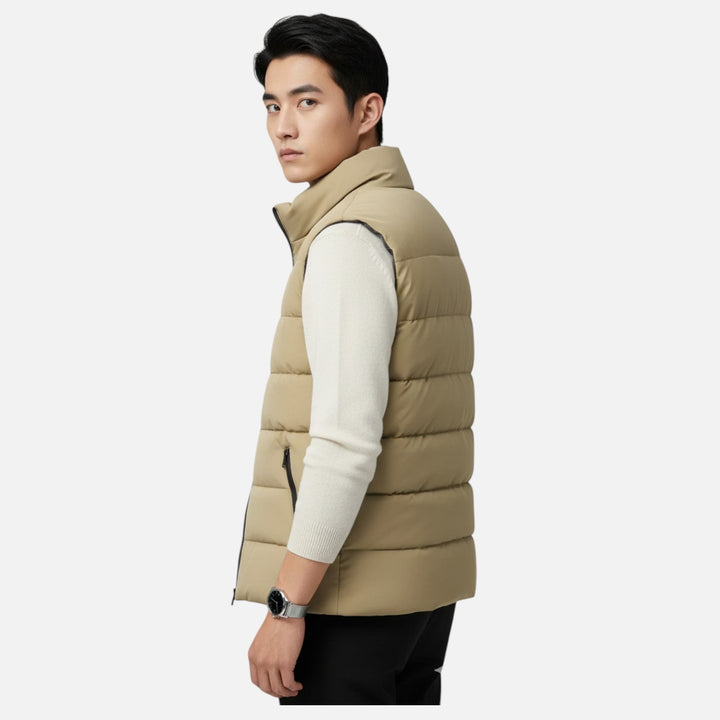 Insulated men's quilted vest, ideal for outdoor adventures & winter warmth. Lightweight & sleek.