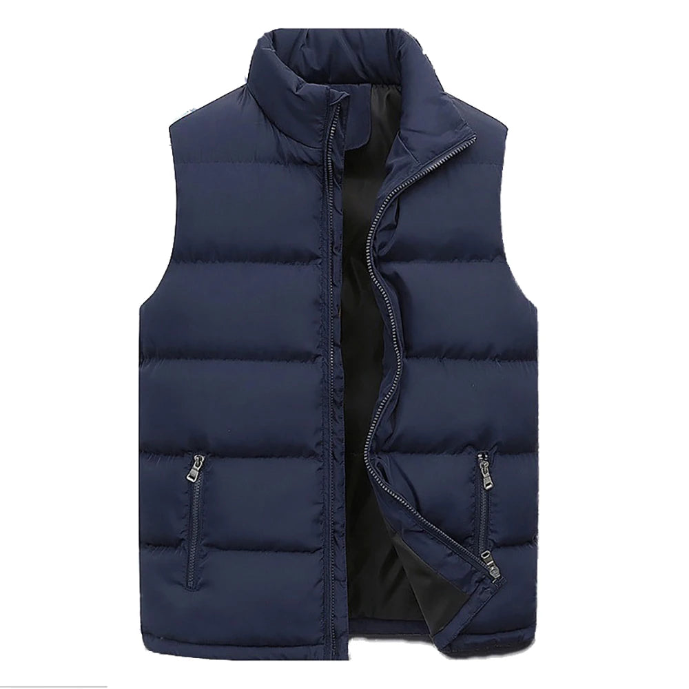 Man wearing a black lightweight quilted vest over a long-sleeved shirt, ideal for layering.