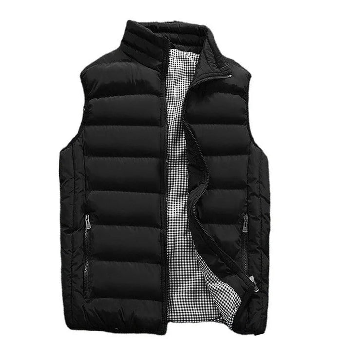 Detailed shot of zipper and collar on a men's lightweight quilted outerwear vest.