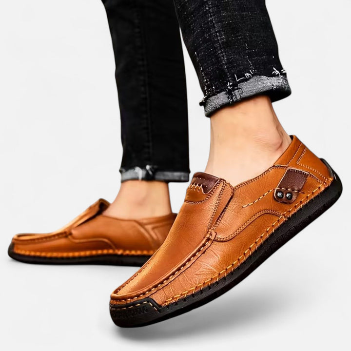 Men's comfortable black slip-on shoes, lightweight & versatile for casual everyday wear.