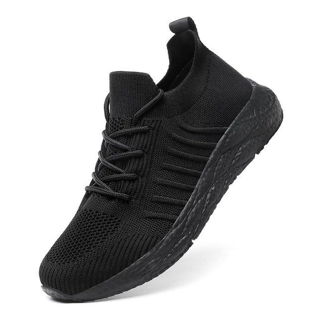 Men's lightweight sport trainers in black with white sole, ideal for athletic activities and everyday comfort.