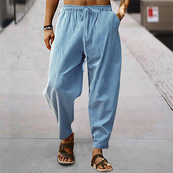Men's lightweight summer pants, breathable fabric, ideal for casual comfort & warm weather.