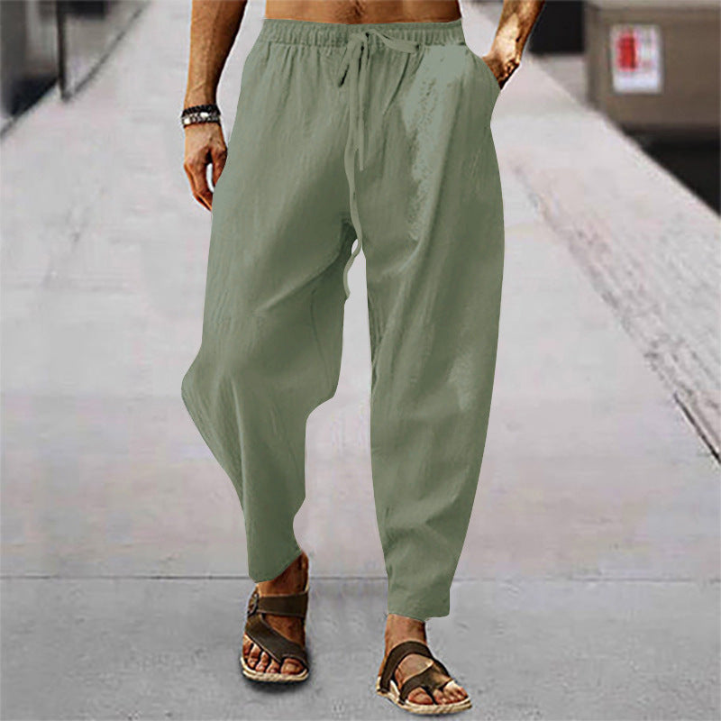 Lightweight men's pants, relaxed fit, offering breathable comfort for warm weather & everyday wear.