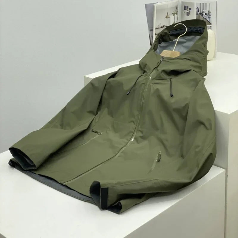 Detail shot of the men's shell jacket zipper and hood, highlighting its waterproof and activewear features.
