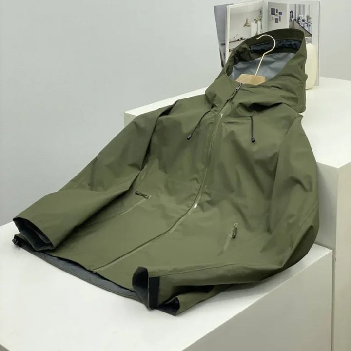 Detail shot of the men's shell jacket zipper and hood, highlighting its waterproof and activewear features.