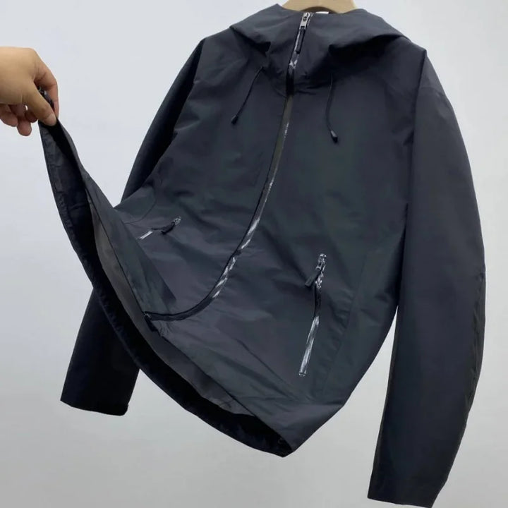 Back view of a men's waterproof shell jacket, showcasing its clean design for active outdoor adventures.