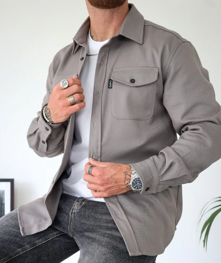 Stylish men's long sleeve button-down shirt, versatile design, close-up of pocket detail