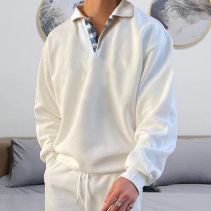 Stylish men's long sleeve polo, modern casual fashion. Versatile top for a relaxed yet sharp look.