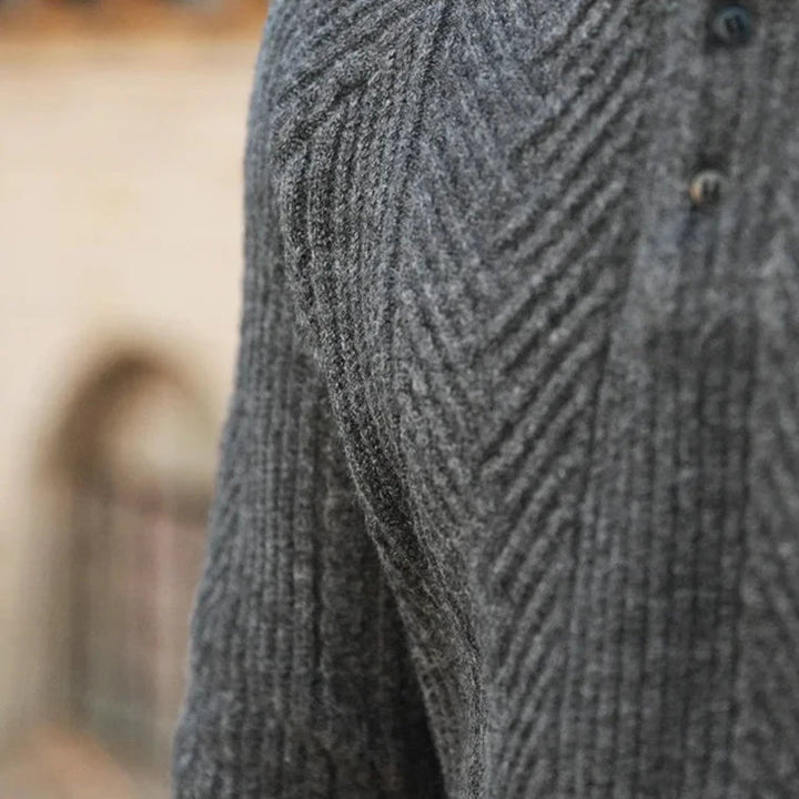Stylish black long sleeve men's polo, featuring a comfortable fit and zip detail.