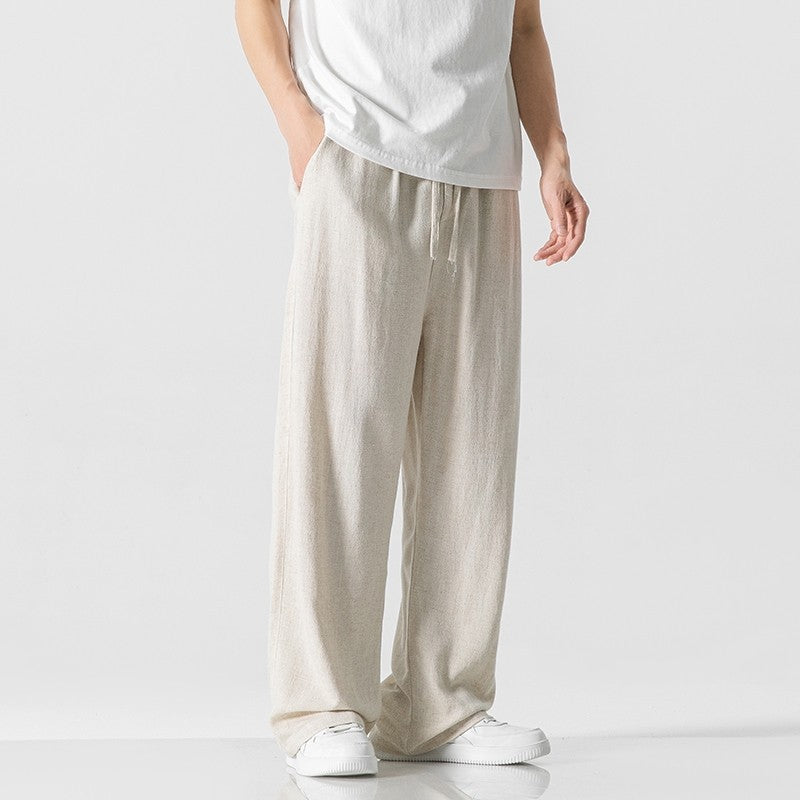 Men's loose fit casual trousers with comfortable drawstring waist, perfect for a relaxed everyday style.