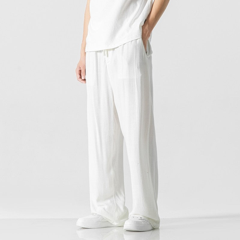 Versatile men's summer trousers, made with easy care fabric and a relaxed fit with a practical drawstring waist.