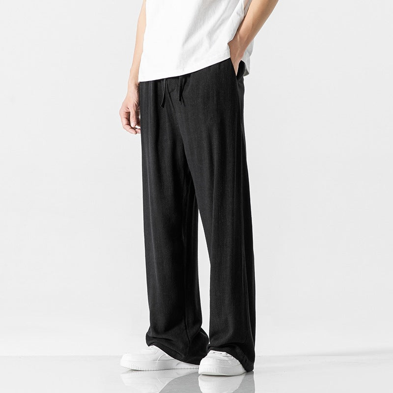 Relaxed style men's casual trousers, loose fit with a functional drawstring waist for easy adjustment and comfort.