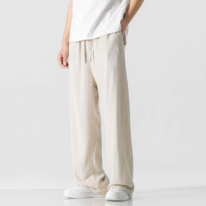 Men's full length casual pants, designed for comfort with a generous loose fit and a secure drawstring waist.