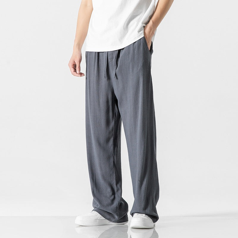 Easy care men's loose fit trousers, perfect for warm weather and summer outings with a comfy drawstring waist.