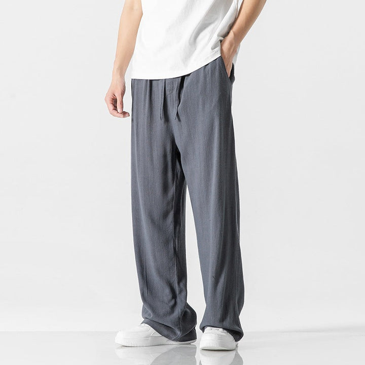 Easy care men's loose fit trousers, perfect for warm weather and summer outings with a comfy drawstring waist.