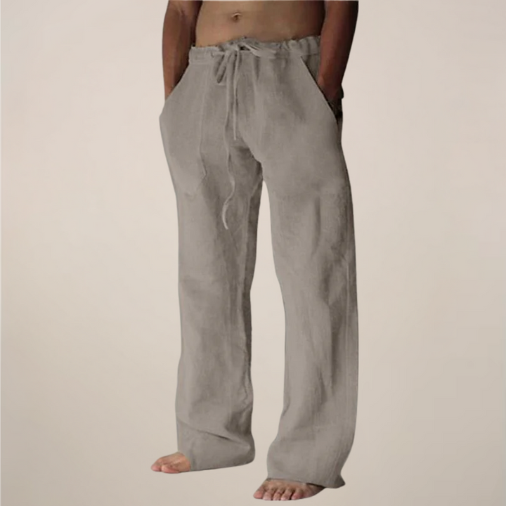 Men's casual loose leg trousers in a neutral khaki color.