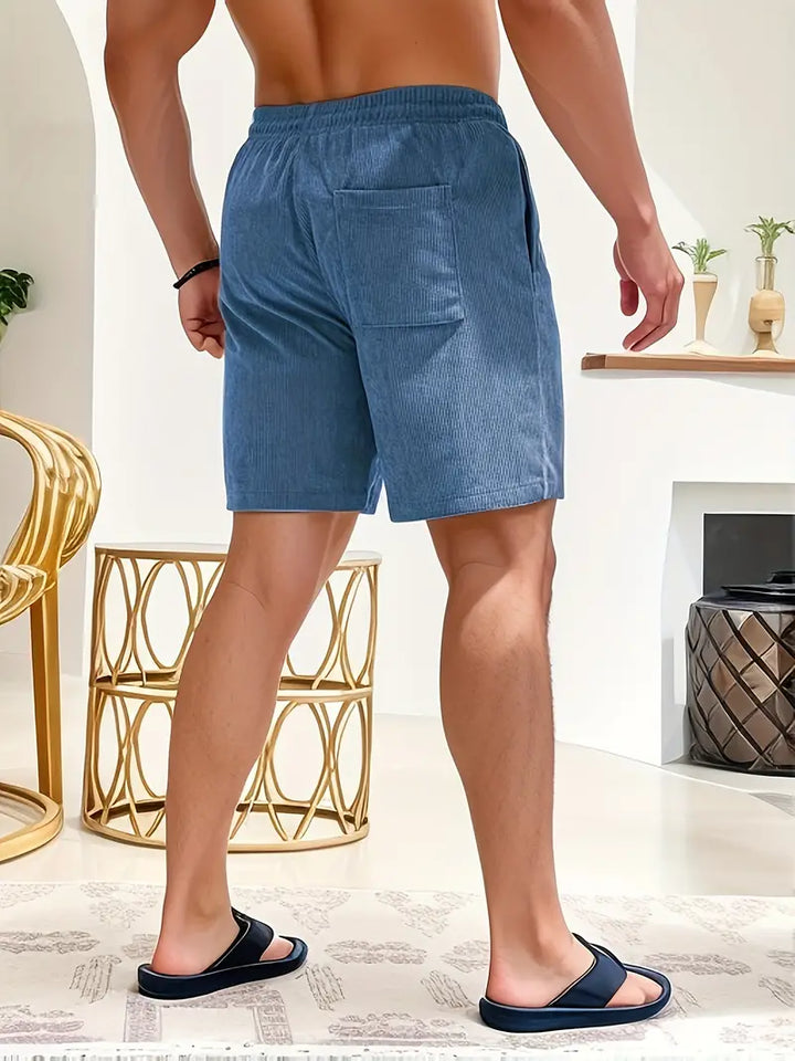Men's casual bottoms: loose-fit shorts with elastic drawstring waist for comfort.