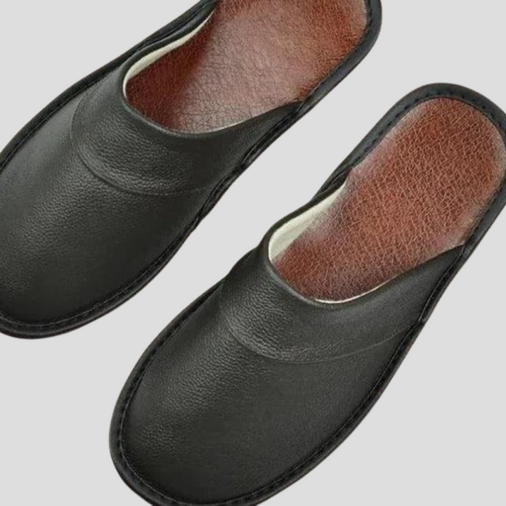 Close-up of men's luxury leather slippers, showcasing fine craftsmanship & soft interior