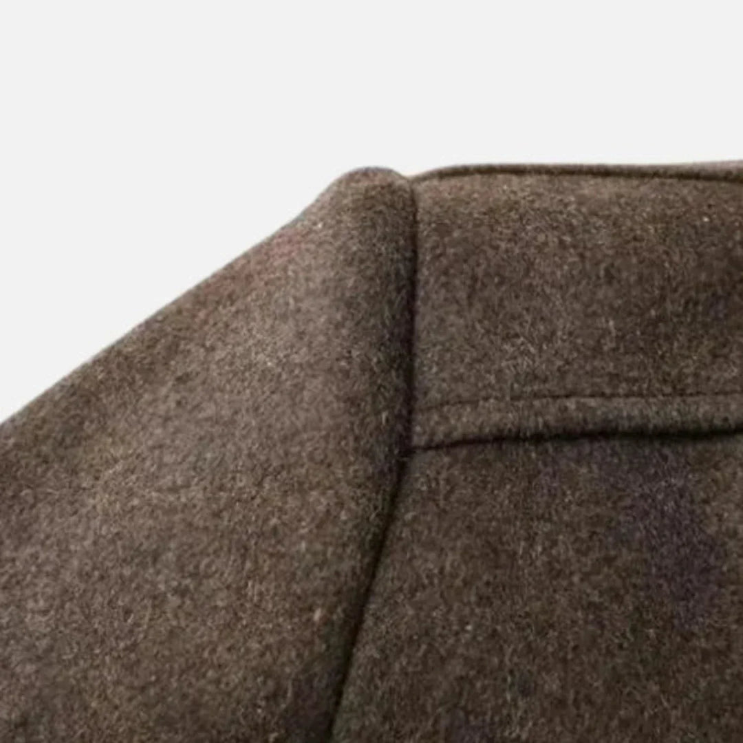 Gray mid-length men's overcoat. Stylish stand collar winter coat, perfect for classic fall fashion outerwear.