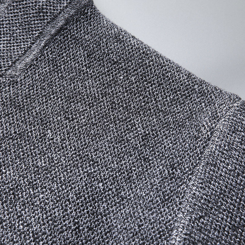 Minimalist men's textured knit cardigan, button-front design, ideal for versatile smart casual layering.